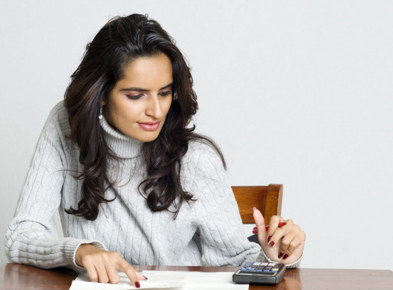 Woman working on bills Woman working on bills