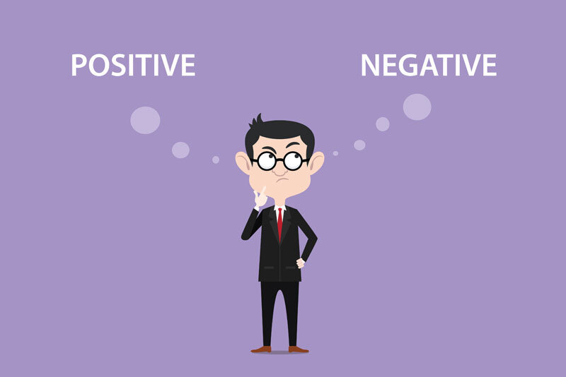 cartoon-man-comparing-positive-and-negative Cartoon Man Comparing Positive and Negative