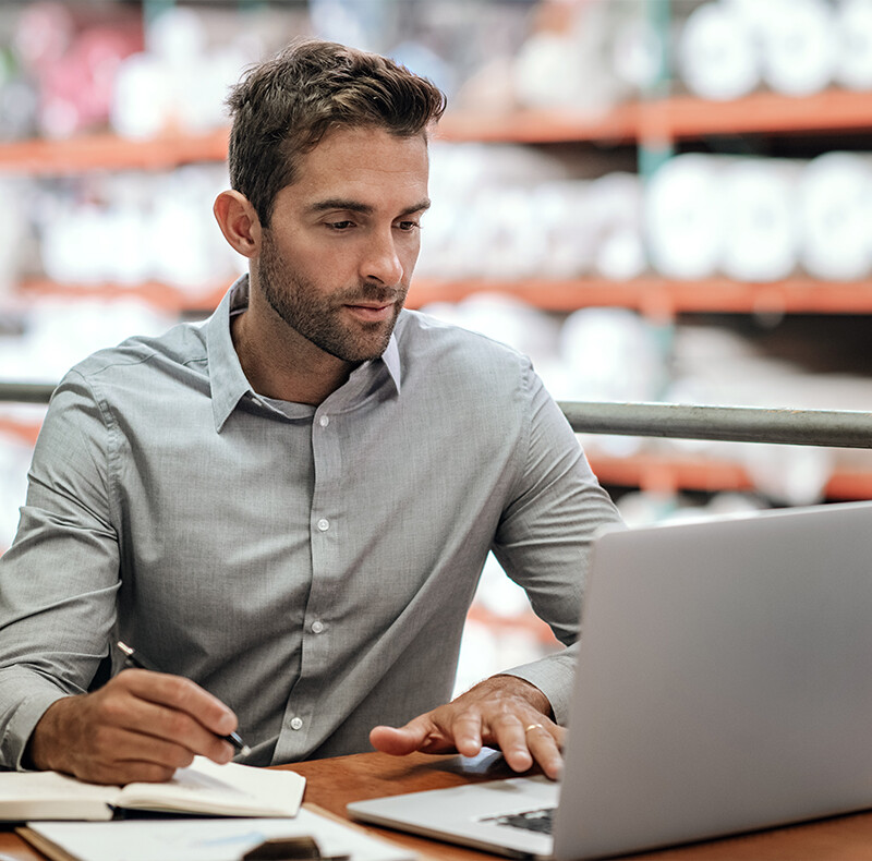 Man in Grey Shirt at Laptop Man in Grey Shirt at Laptop