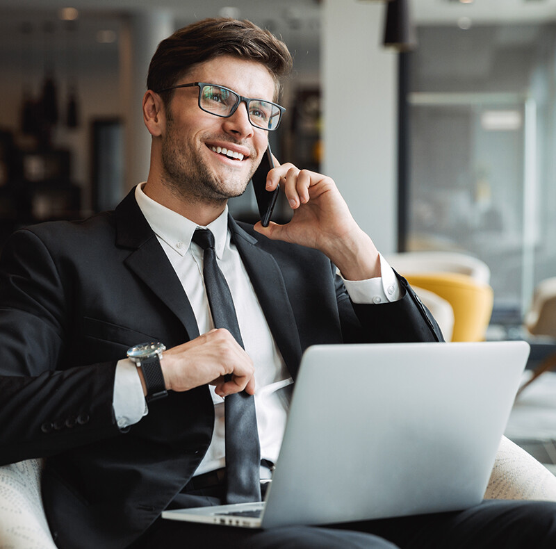 Man in Suit Talking on Cell Phone Man in Suit Talking on Cell Phone