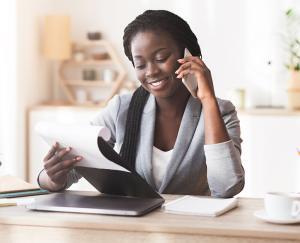 Woman in Business Suit talking on Phone Woman in Business Suit talking on Phone