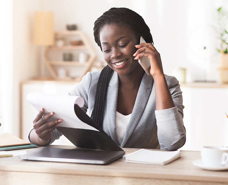 Woman in Business Suit talking on Phone Woman in Business Suit talking on Phone