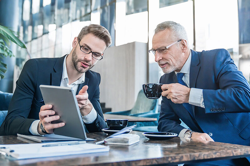 Business Partners Reviewing Files Business Partners Reviewing Files